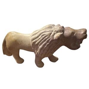 Lion stone figurine 7 1/2 inches long and 3 1/2 inch tall made in Kenya.